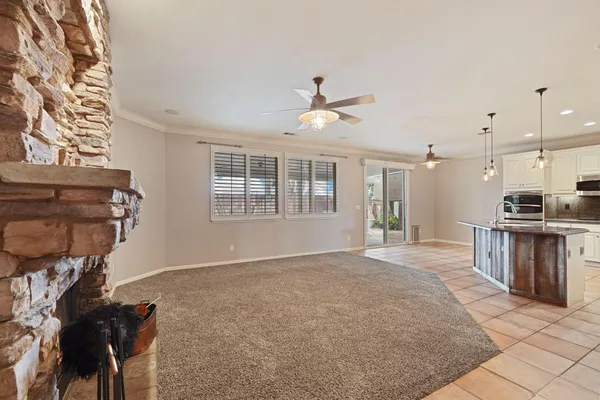 a view of an empty room with a kitchen