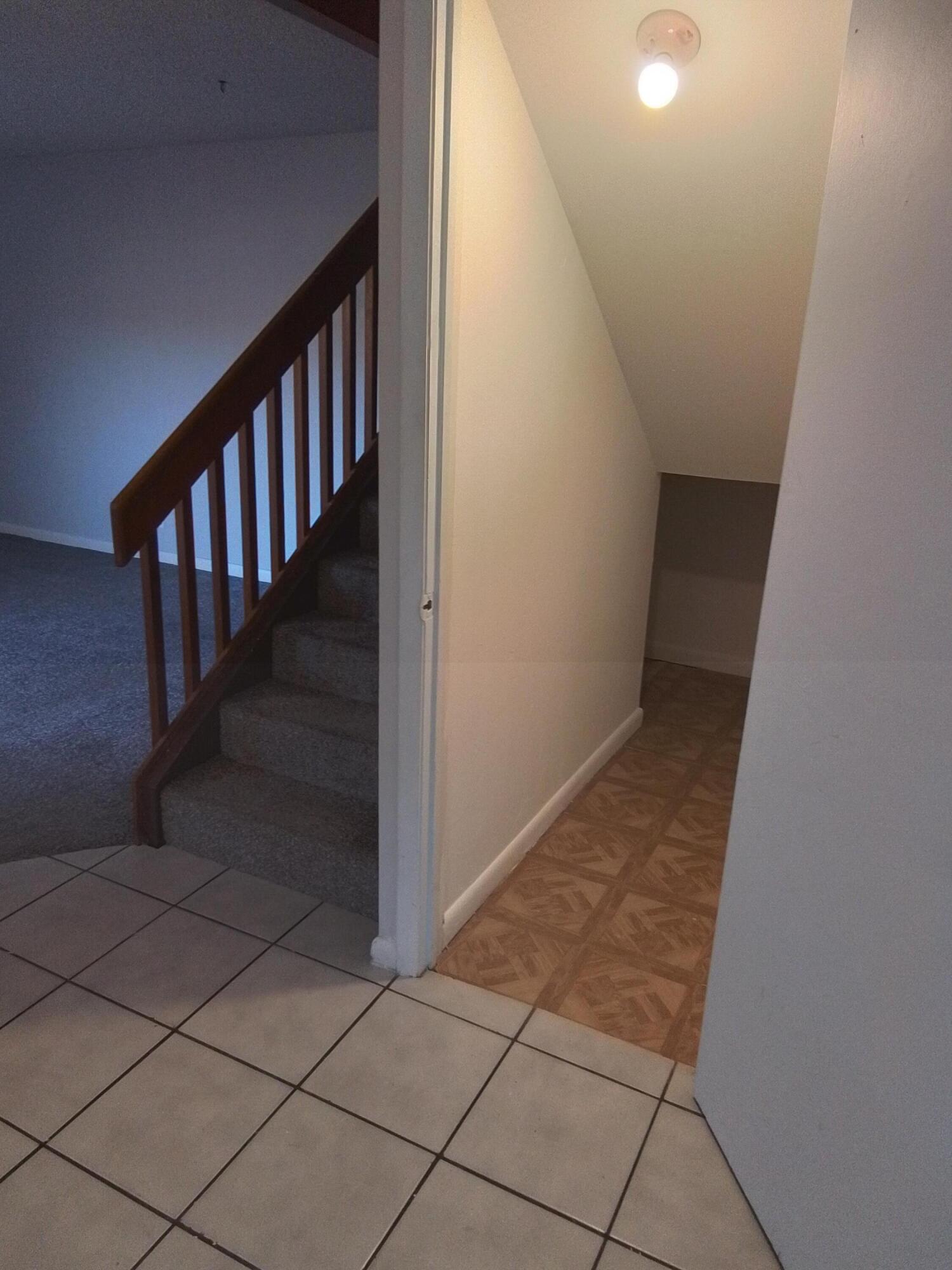 1458 North Lawnwood Circle, Unit 23C Fort Pierce, FL 34950 - Photo 12 of 42 a view of entryway with wooden floor