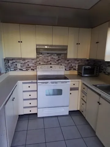 a view of a utility room with staircase