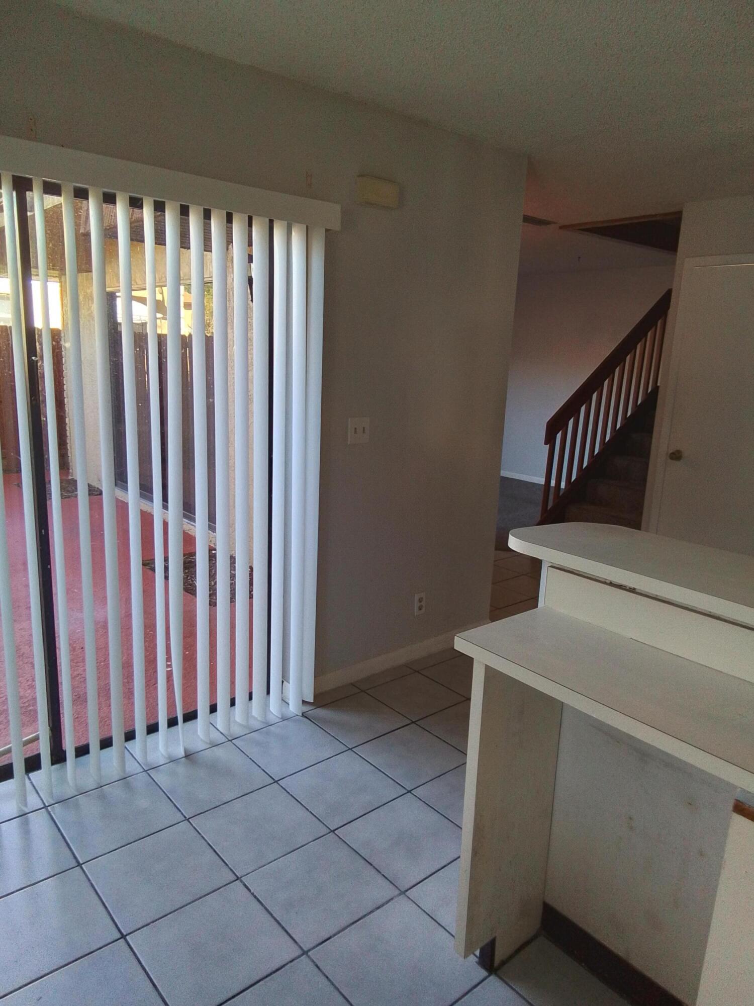 1458 North Lawnwood Circle, Unit 23C Fort Pierce, FL 34950 - Photo 17 of 42 a view of a utility room with staircase