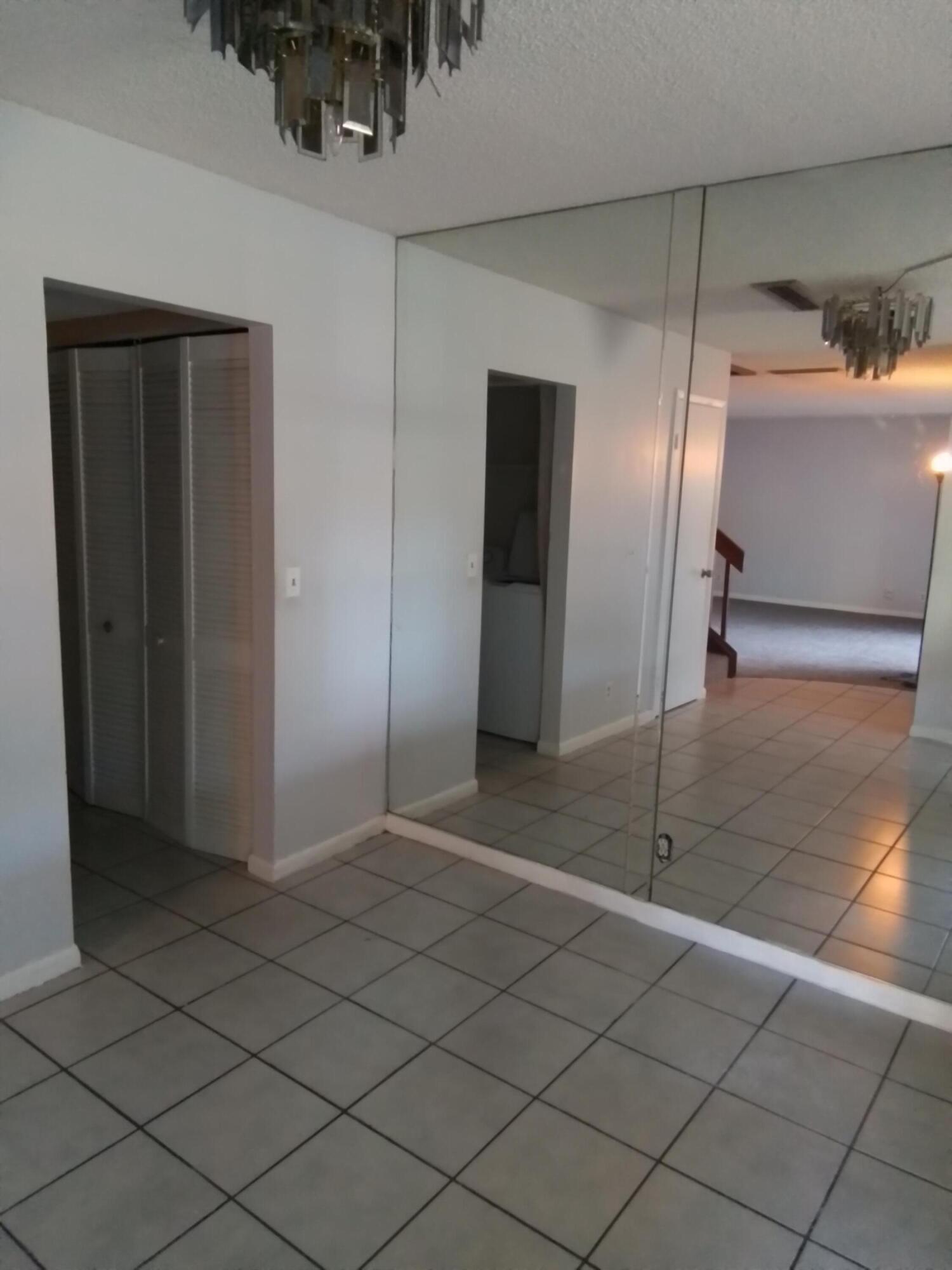 1458 North Lawnwood Circle, Unit 23C Fort Pierce, FL 34950 - Photo 20 of 42 a view of a hallway