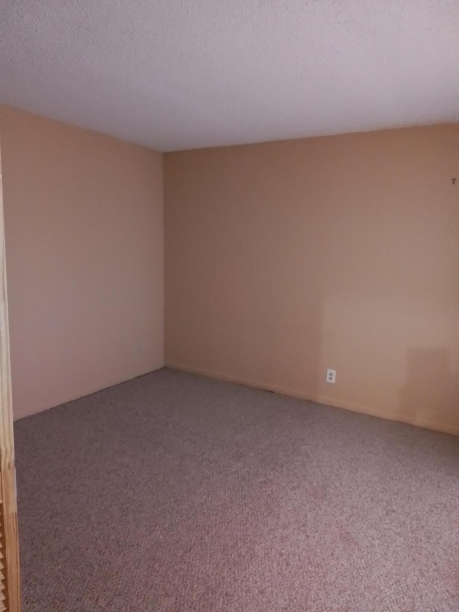 1458 North Lawnwood Circle, Unit 23C Fort Pierce, FL 34950 - Photo 27 of 42 a view of an empty room and has a window