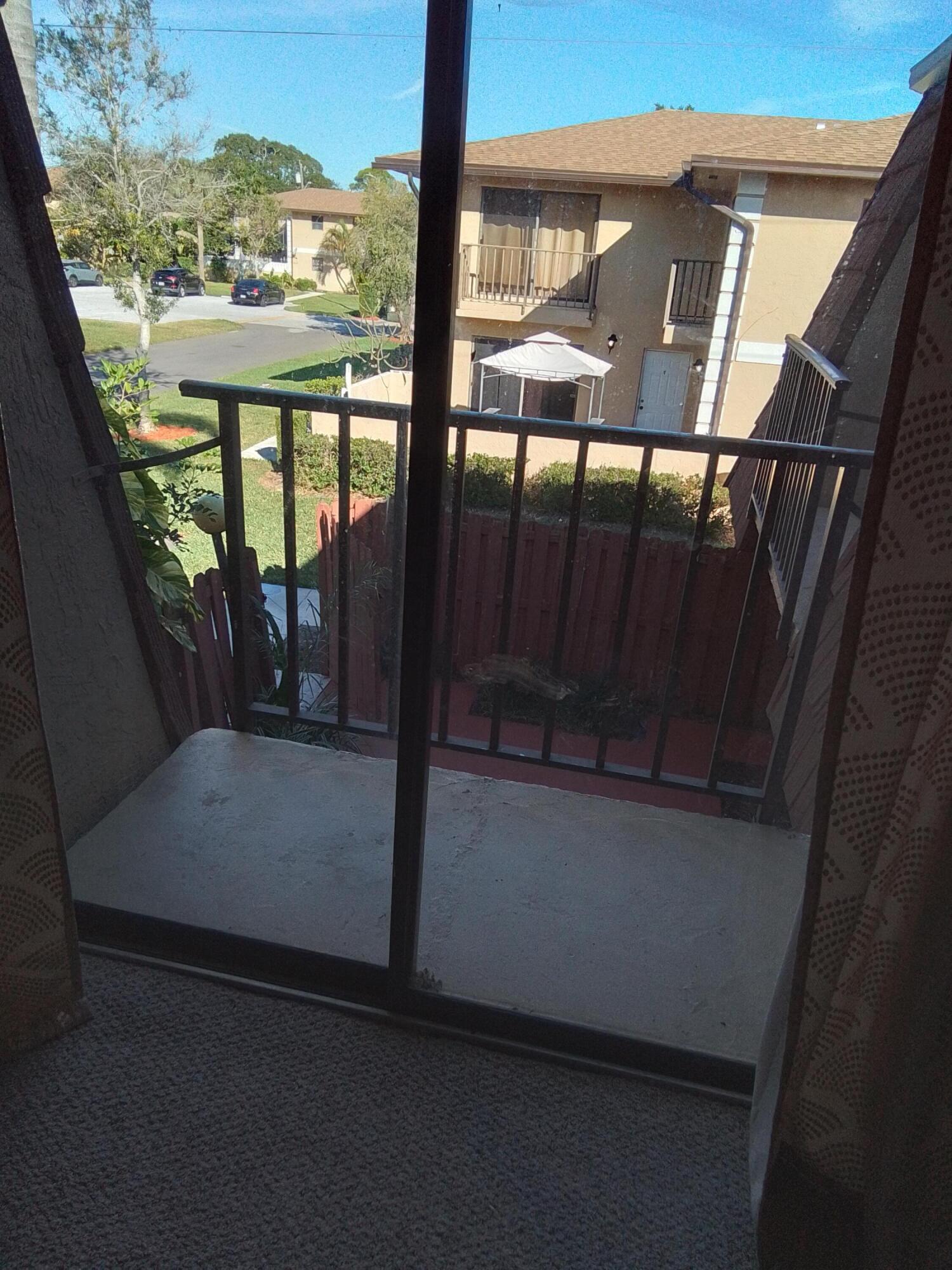 1458 North Lawnwood Circle, Unit 23C Fort Pierce, FL 34950 - Photo 32 of 42 a view of balcony with furniture