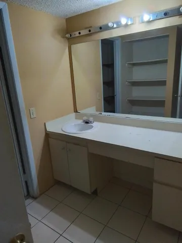 a bathroom with a bathtub and sink