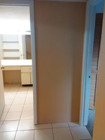 a open kitchen with a sink and cabinets