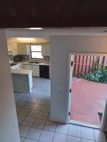 a balcony with table and chairs