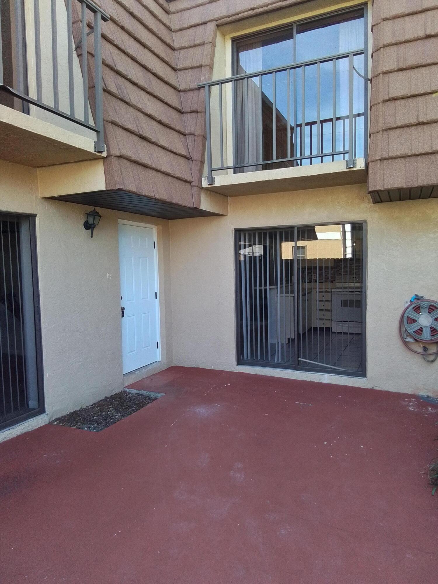 1458 North Lawnwood Circle, Unit 23C Fort Pierce, FL 34950 - Photo 40 of 42 a view of an entrance of the building