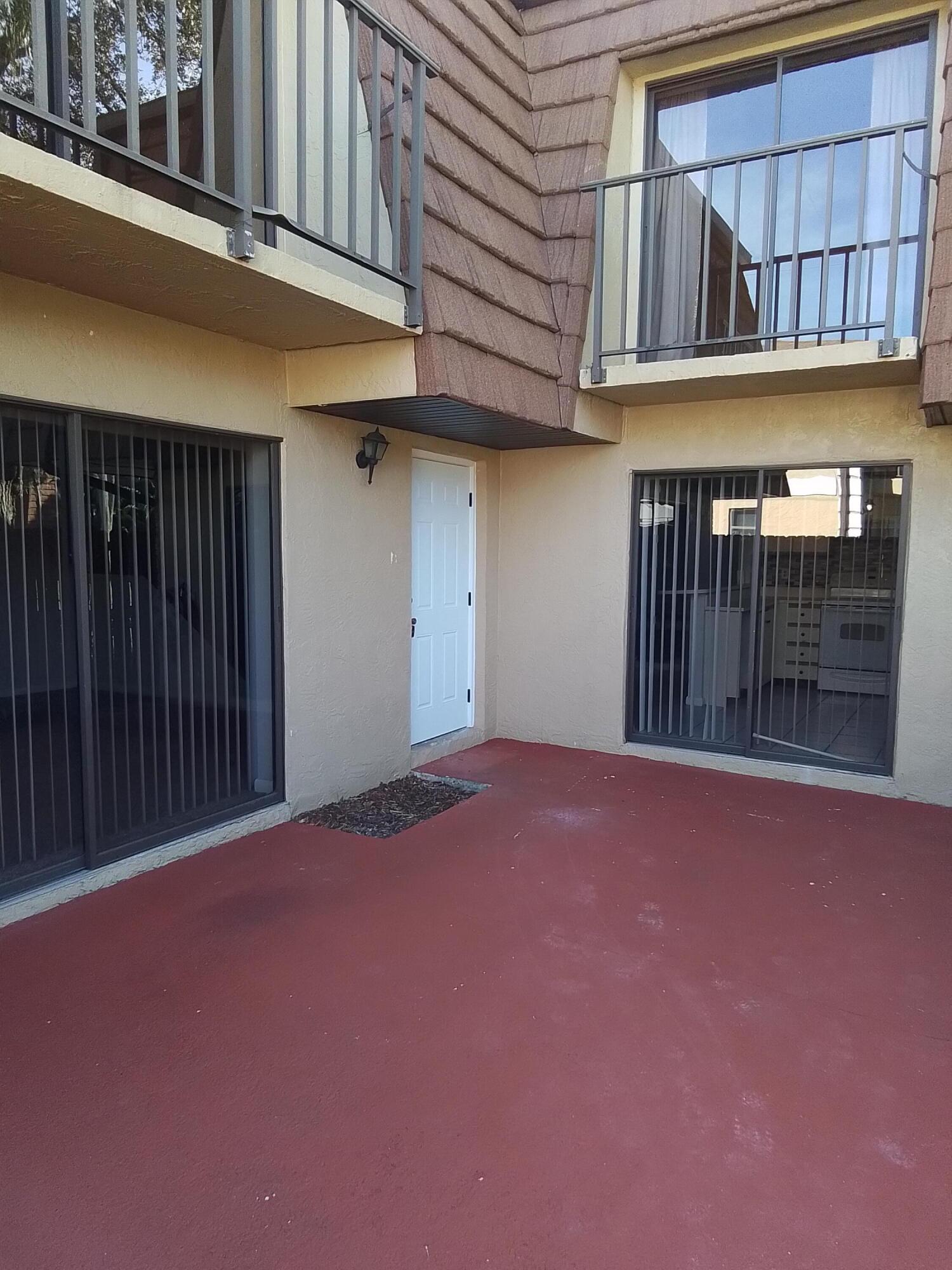 1458 North Lawnwood Circle, Unit 23C Fort Pierce, FL 34950 - Photo 42 of 42 a view of a house with a garage