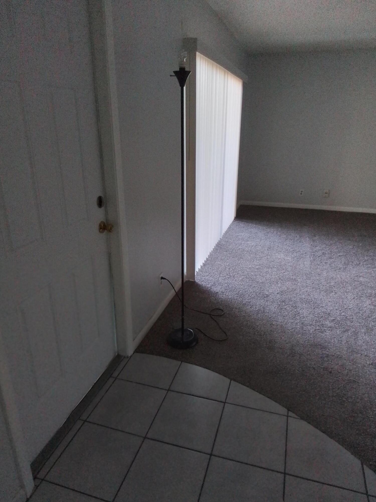 1458 North Lawnwood Circle, Unit 23C Fort Pierce, FL 34950 - Photo 5 of 42 a view of an empty room