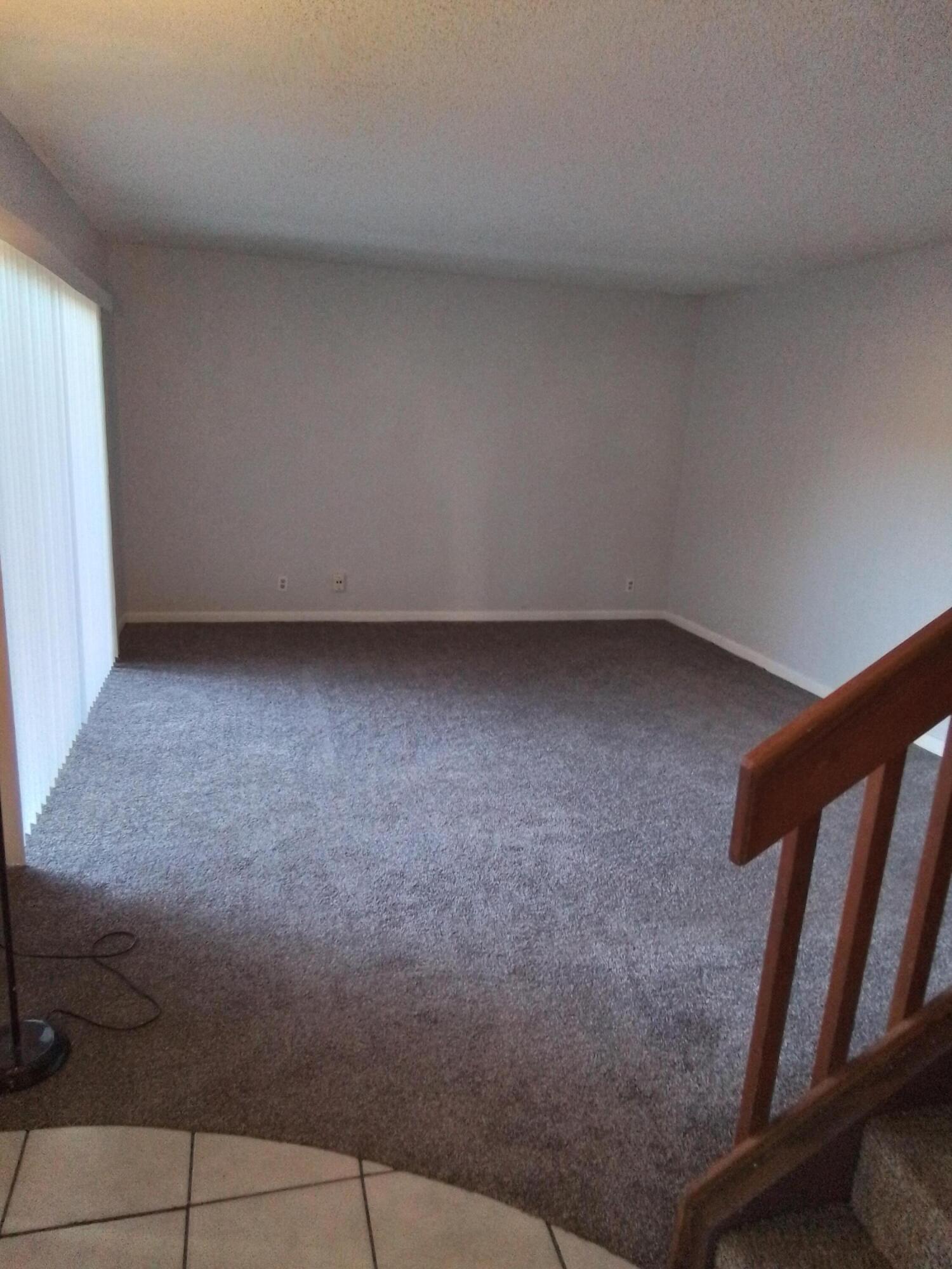 1458 North Lawnwood Circle, Unit 23C Fort Pierce, FL 34950 - Photo 6 of 42 a view of an empty room