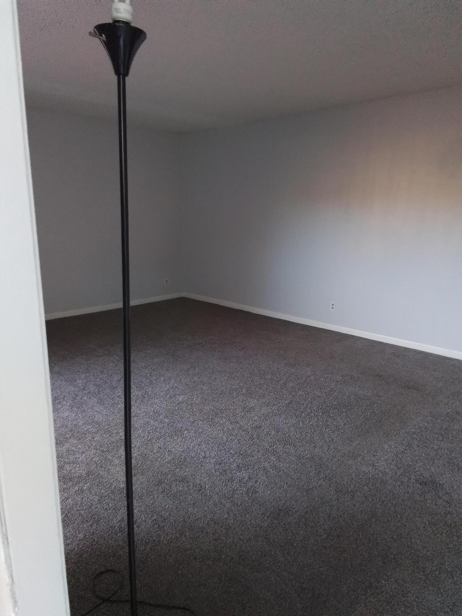 1458 North Lawnwood Circle, Unit 23C Fort Pierce, FL 34950 - Photo 7 of 42 a view of a room with a fan