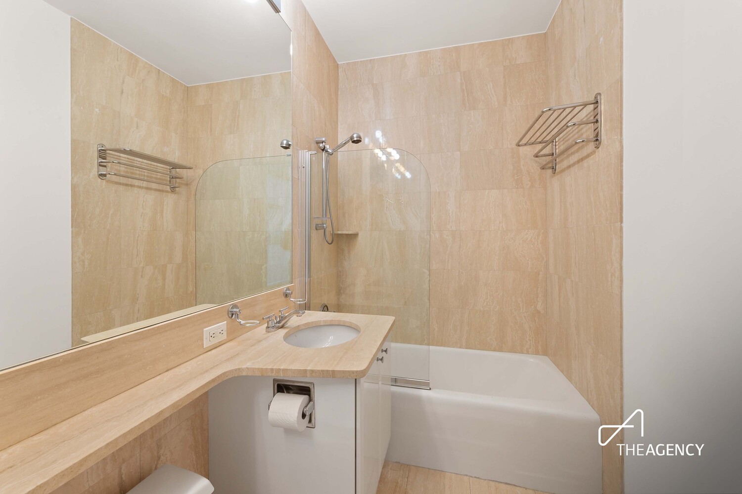 200 Riverside Boulevard, Unit 25C Manhattan, NY 10069 - Photo 10 of 17 a bathroom with a sink a toilet and shower