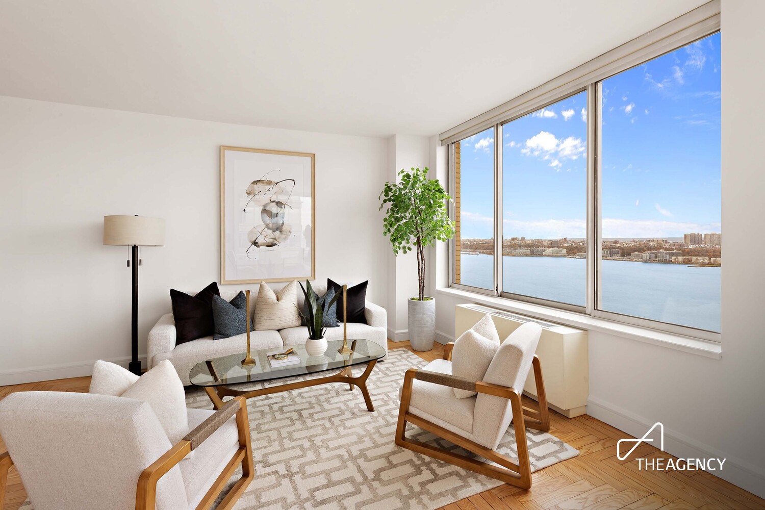 200 Riverside Boulevard, Unit 25C Manhattan, NY 10069 - Photo 3 of 17 a living room with furniture and a large window