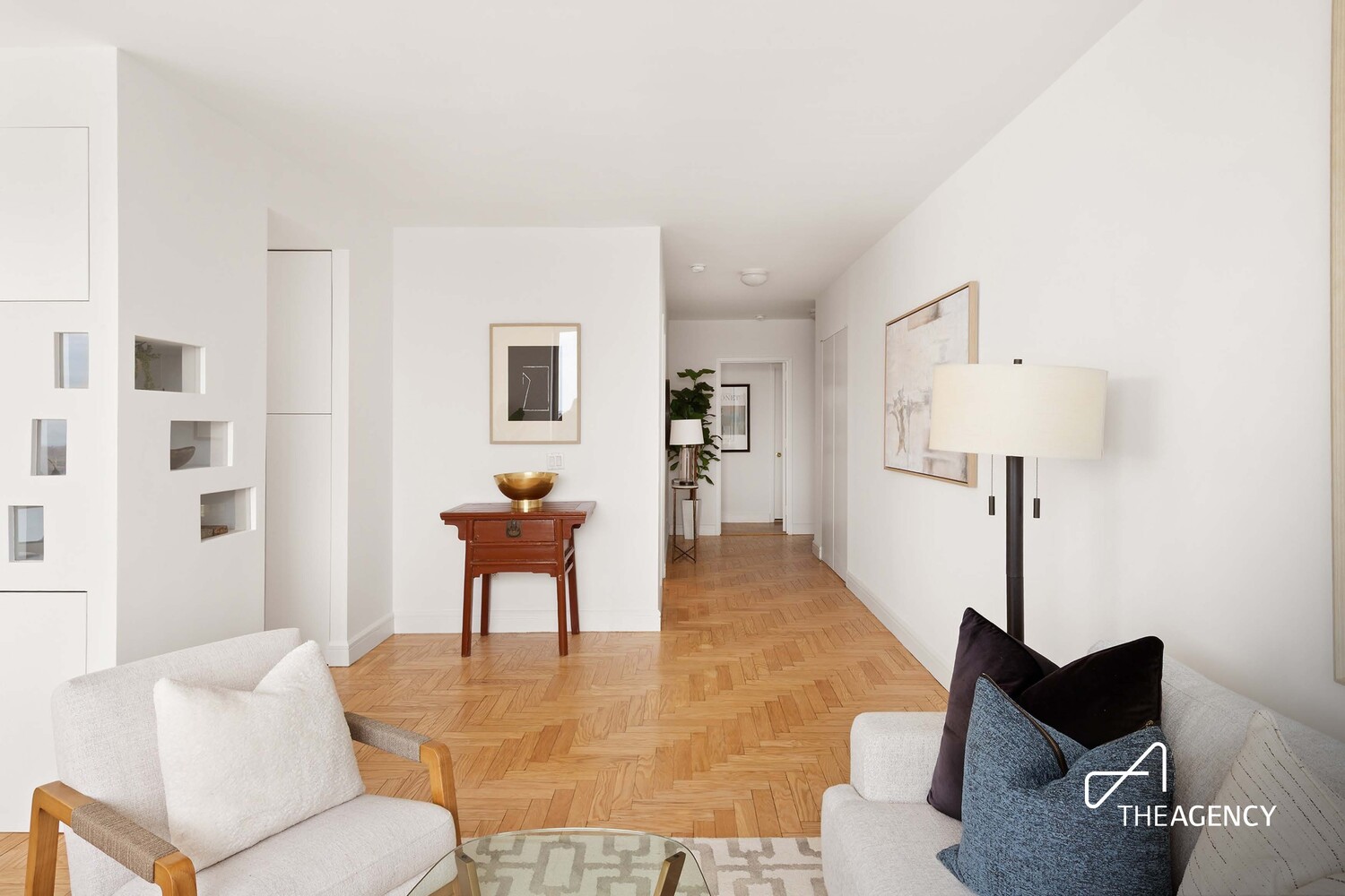 200 Riverside Boulevard, Unit 25C Manhattan, NY 10069 - Photo 4 of 17 a living room with furniture and a wooden floor