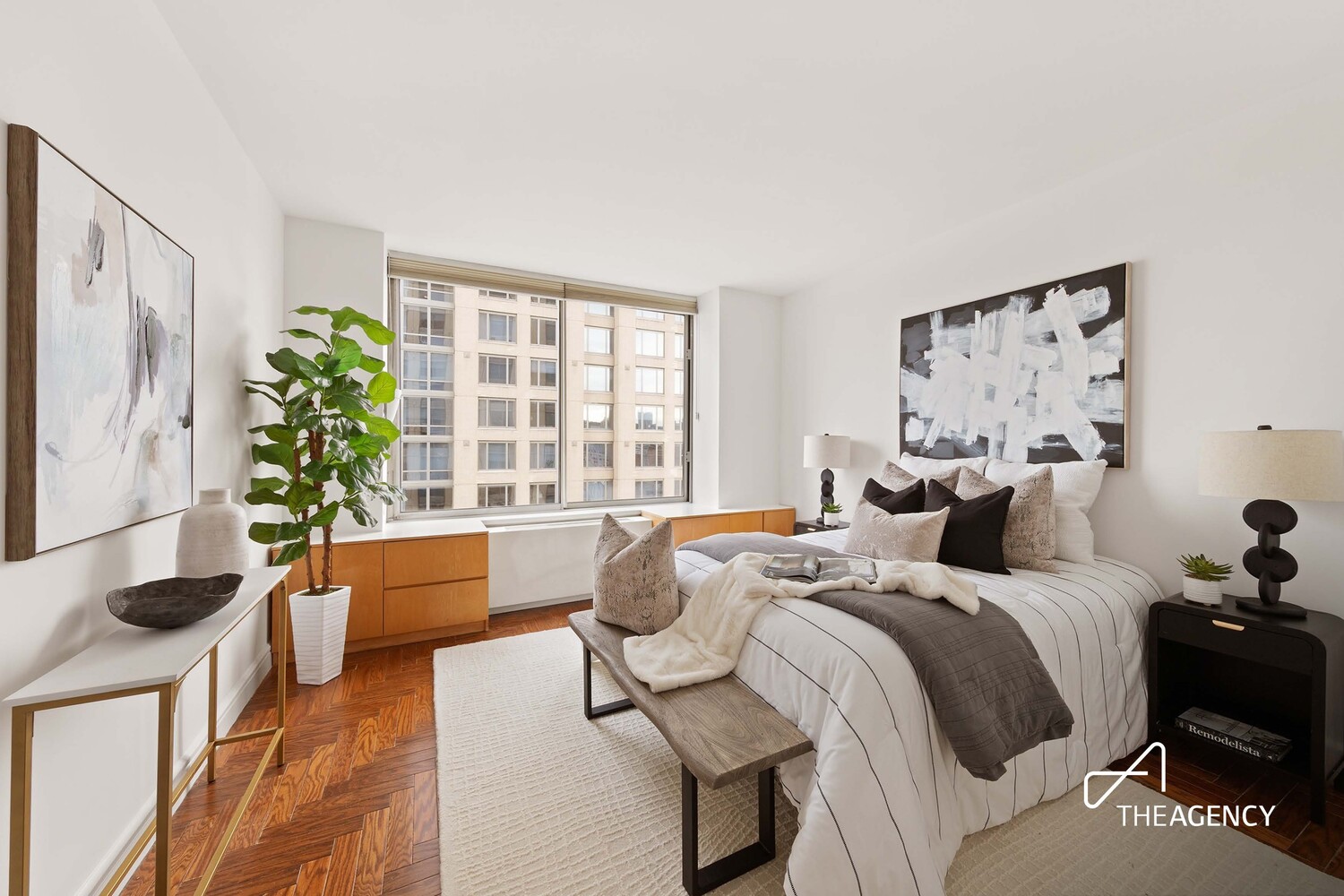 200 Riverside Boulevard, Unit 25C Manhattan, NY 10069 - Photo 5 of 17 a bedroom with a bed and a large window