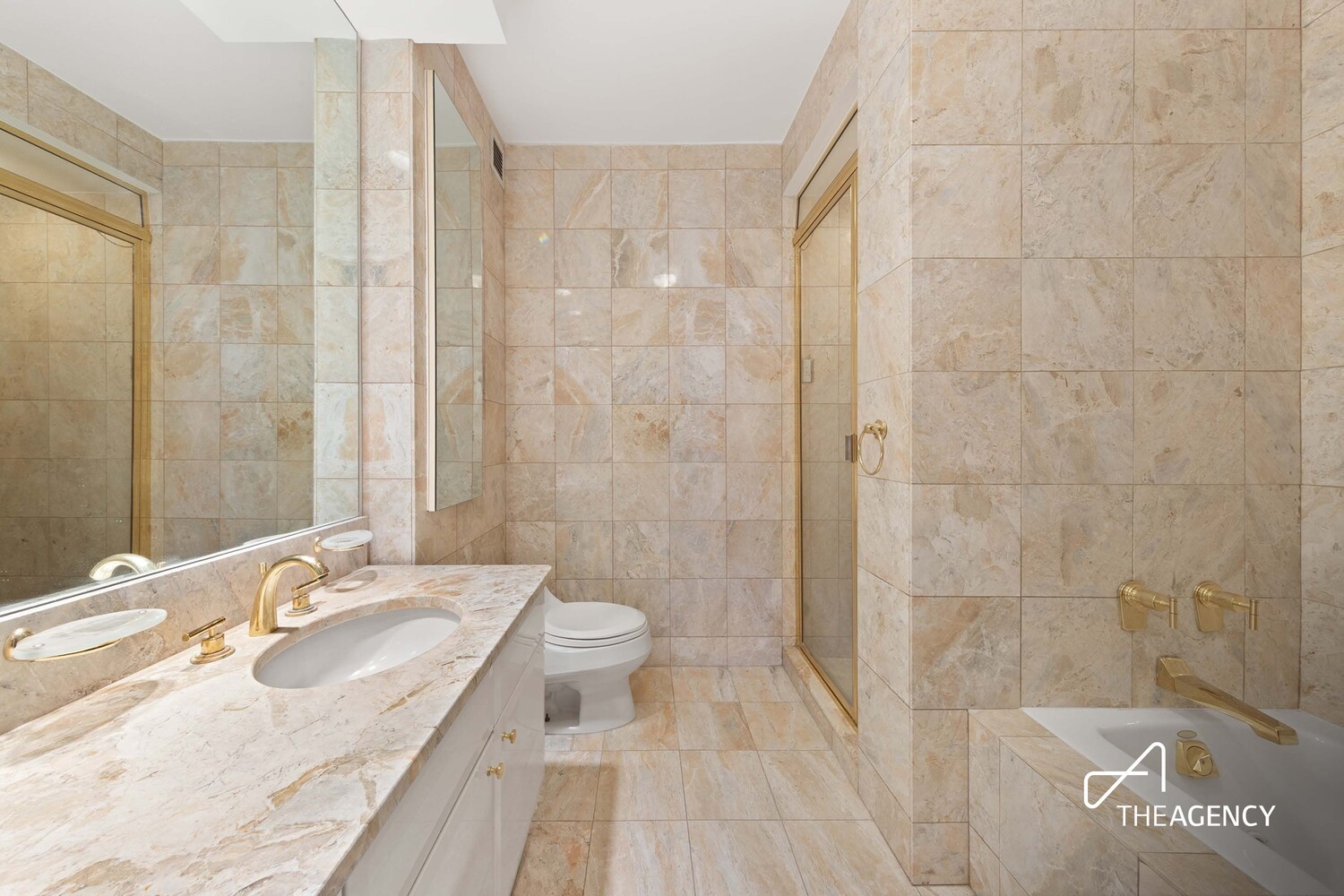 200 Riverside Boulevard, Unit 25C Manhattan, NY 10069 - Photo 7 of 17 a bathroom with a sink a toilet and shower