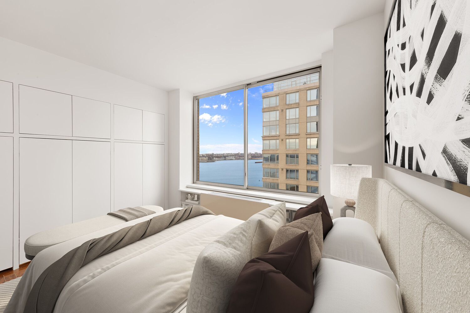 200 Riverside Boulevard, Unit 25C Manhattan, NY 10069 - Photo 8 of 17 a bedroom with a bed and a large window