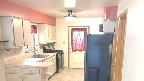 a bathroom with a sink vanity toilet and a mirror