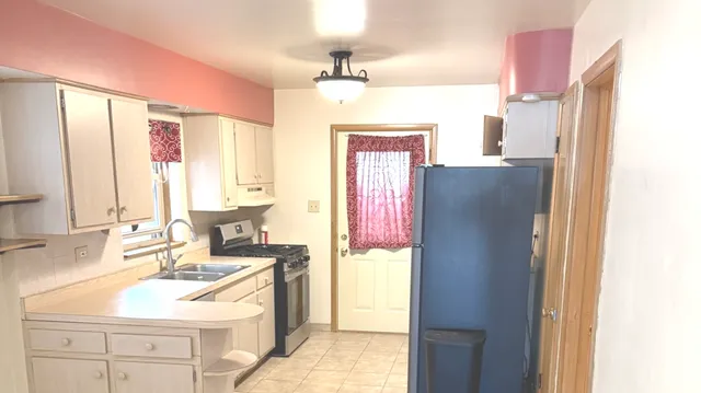 a bathroom with a sink vanity toilet and a mirror