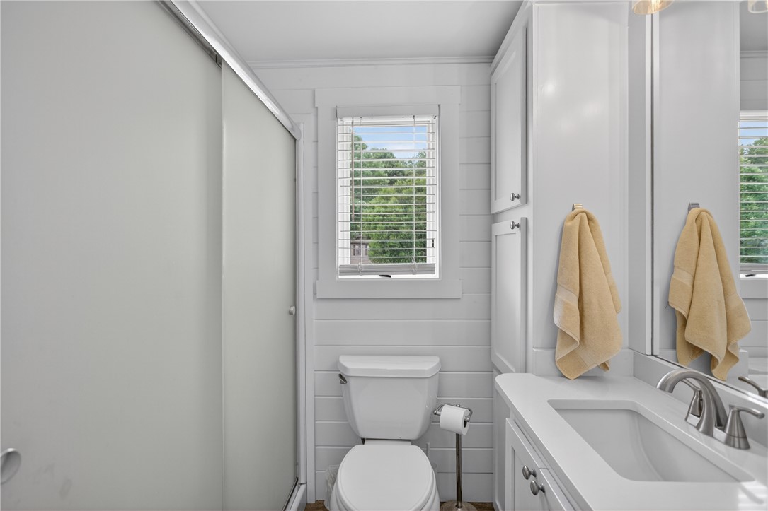 1230 Melton Road, Unit 4 West Union, SC 29696 - Photo 18 of 48 A well-appointed bathroom with clean white cabinetry and natural light streaming through the window.
