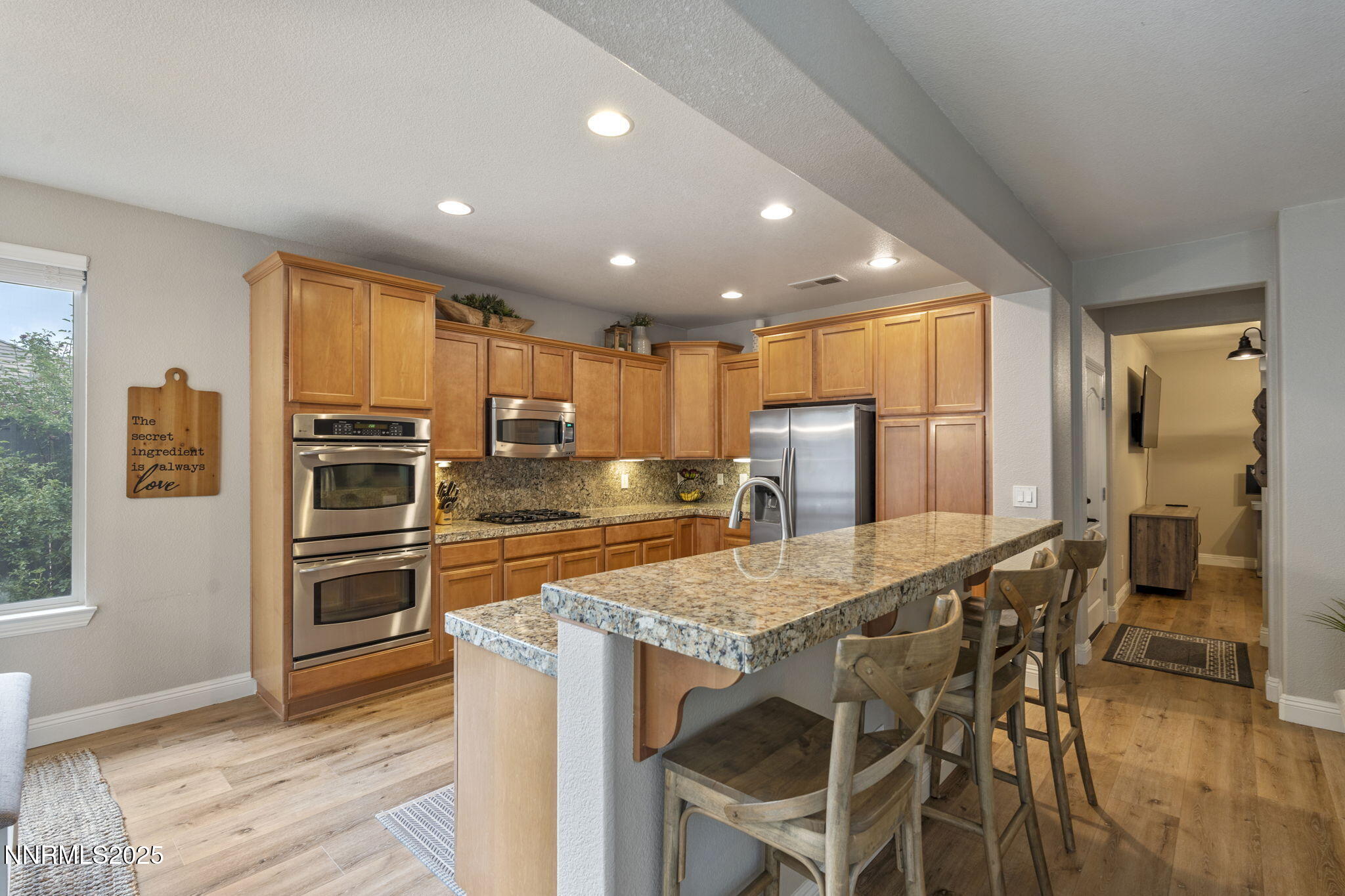 640 Preakness Court Reno, NV 89521 - Photo 15 of 59 a kitchen with a table and refrigerator