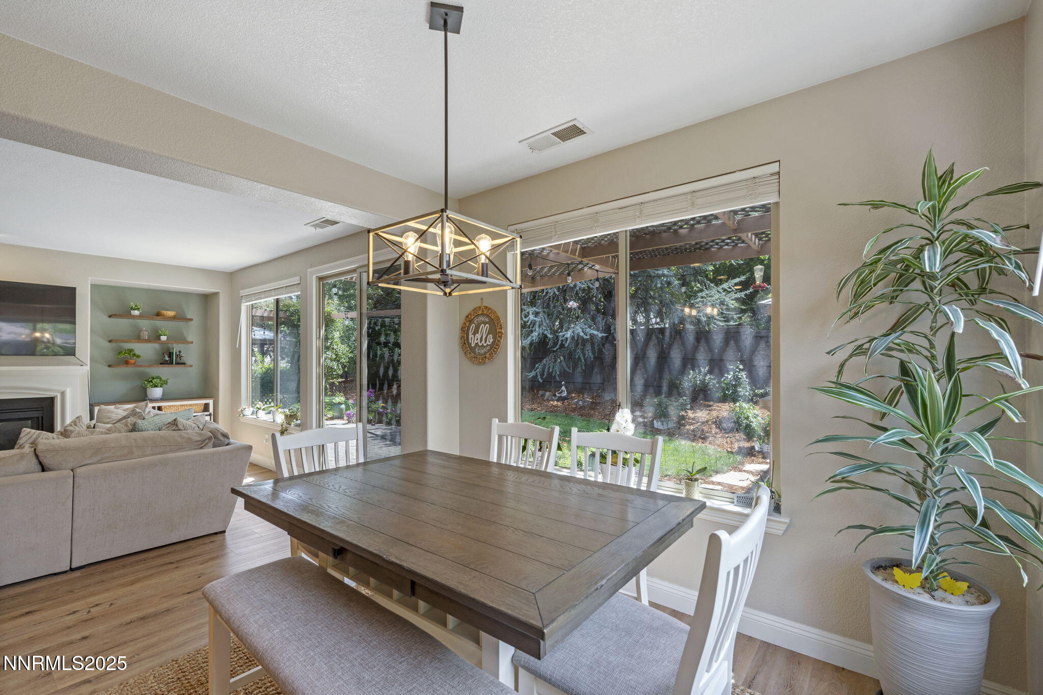 640 Preakness Court Reno, NV 89521 - Photo 23 of 59 a dining room with furniture a chandelier and wooden floor