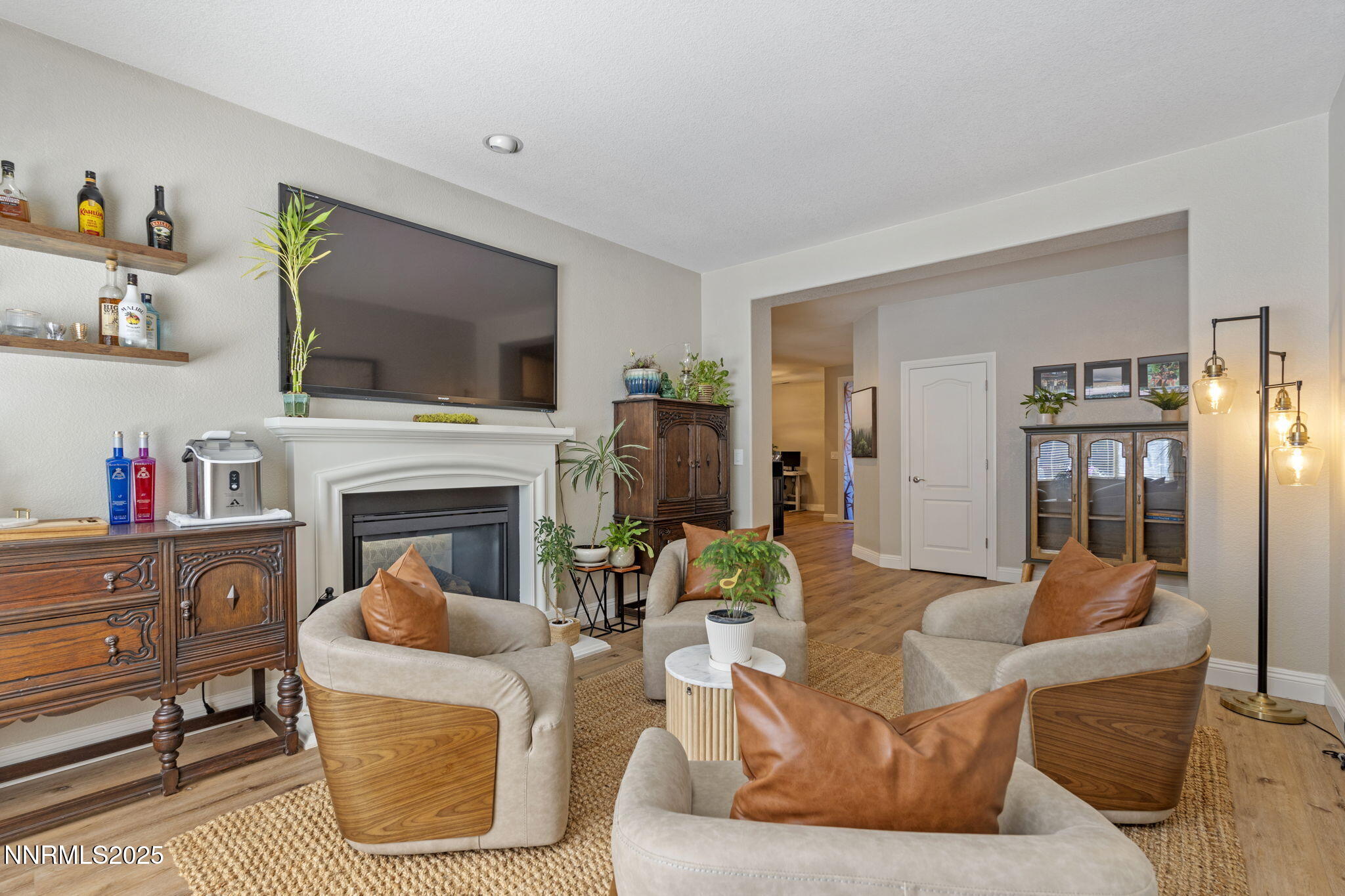 640 Preakness Court Reno, NV 89521 - Photo 28 of 59 a living room with furniture a flat screen tv and a fireplace