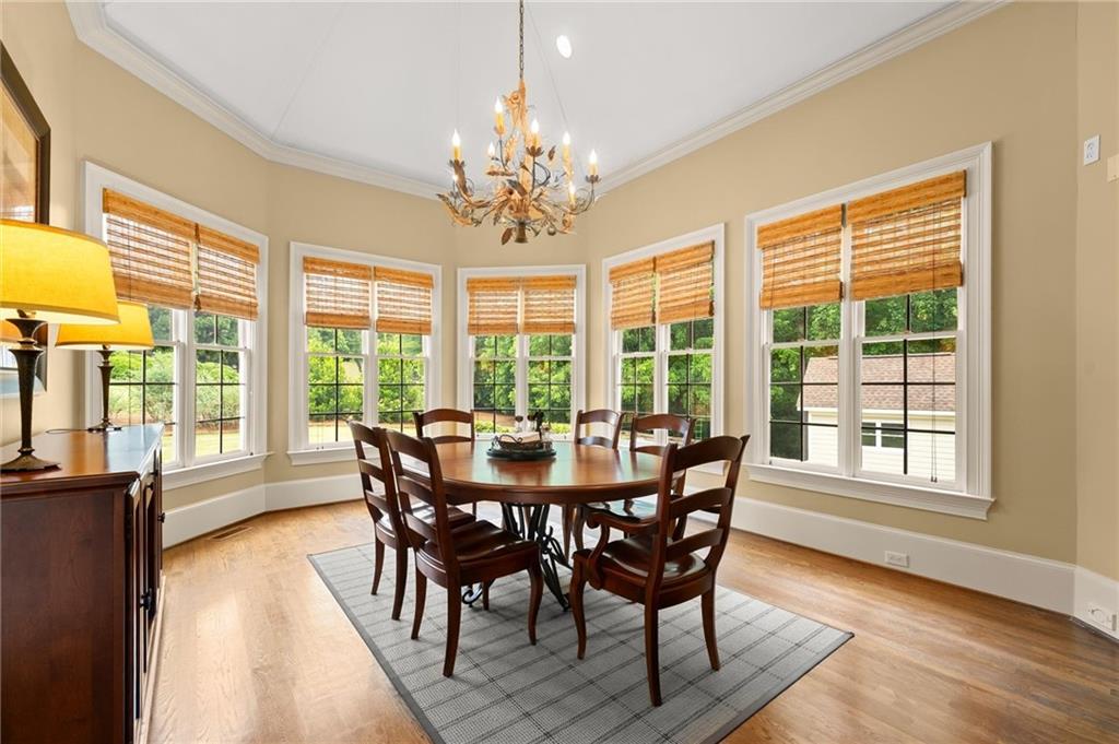 322 Edwards Brook Lane Canton, GA 30115 - Photo 31 of 99 a view of a dining room with furniture windows and wooden floor