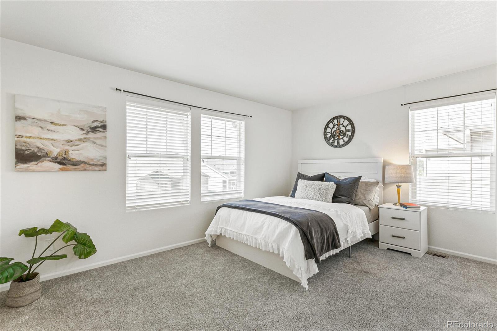11159 East 25th Drive Aurora, CO 80010 - Photo 14 of 23 a bed room with a bed and a window