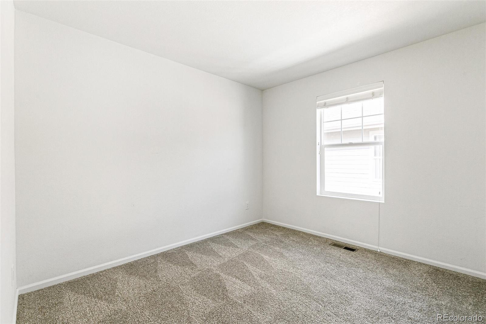 11159 East 25th Drive Aurora, CO 80010 - Photo 17 of 23 an empty room with a window