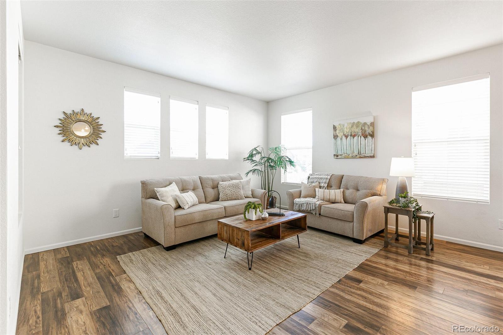 11159 East 25th Drive Aurora, CO 80010 - Photo 4 of 23 a living room with furniture and a window