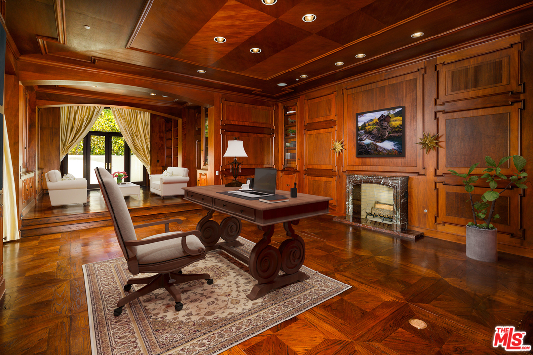 73 Beverly Park Lane Beverly Hills, CA 90210 - Photo 12 of 24 a living room with patio furniture and a wooden floor