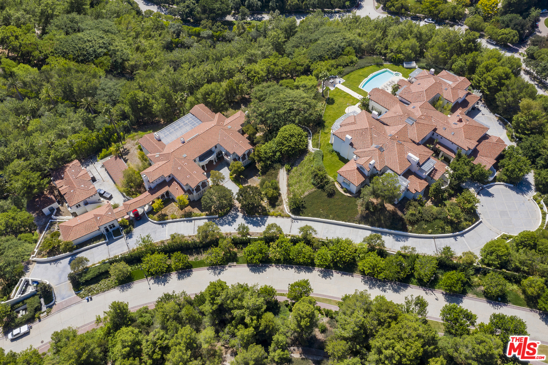 73 Beverly Park Lane Beverly Hills, CA 90210 - Photo 3 of 24 an aerial view of residential houses with outdoor space and swimming pool