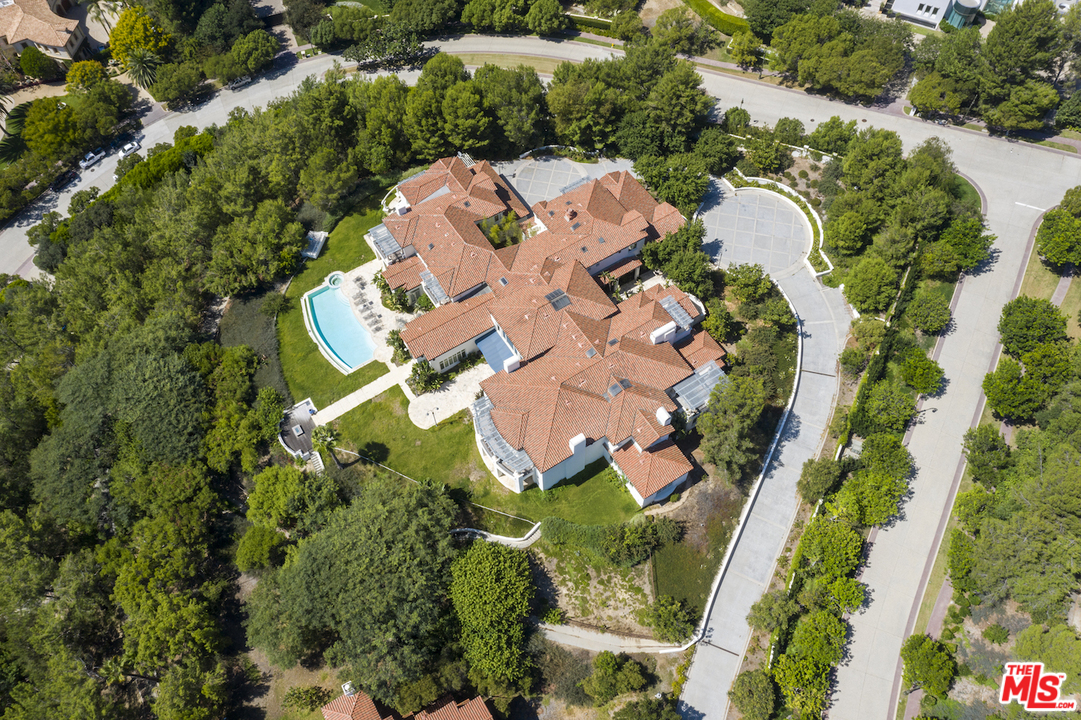 73 Beverly Park Lane Beverly Hills, CA 90210 - Photo 4 of 24 an aerial view of a house with a yard and swimming pool