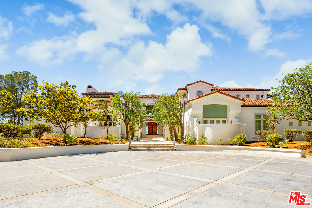 73 Beverly Park Lane Beverly Hills, CA 90210 - Photo 5 of 24 a view of a building with a street