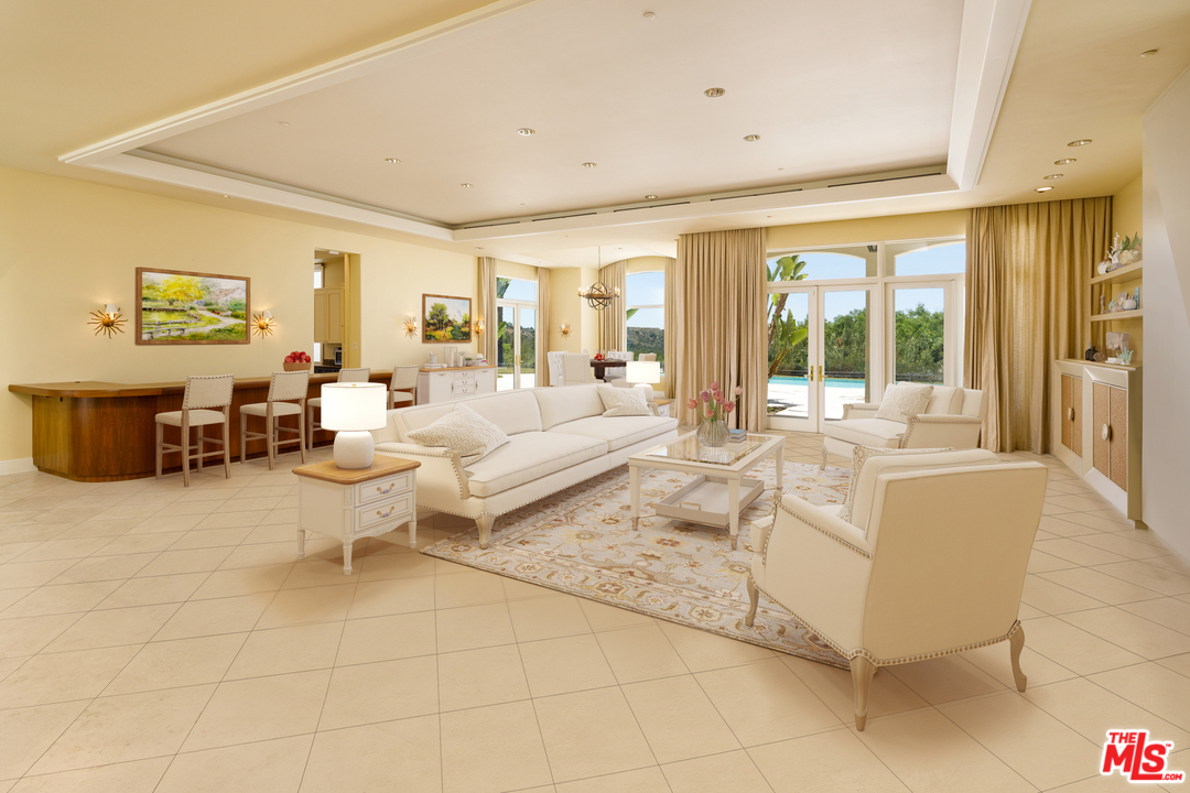 73 Beverly Park Lane Beverly Hills, CA 90210 - Photo 9 of 24 a living room with furniture and a large window