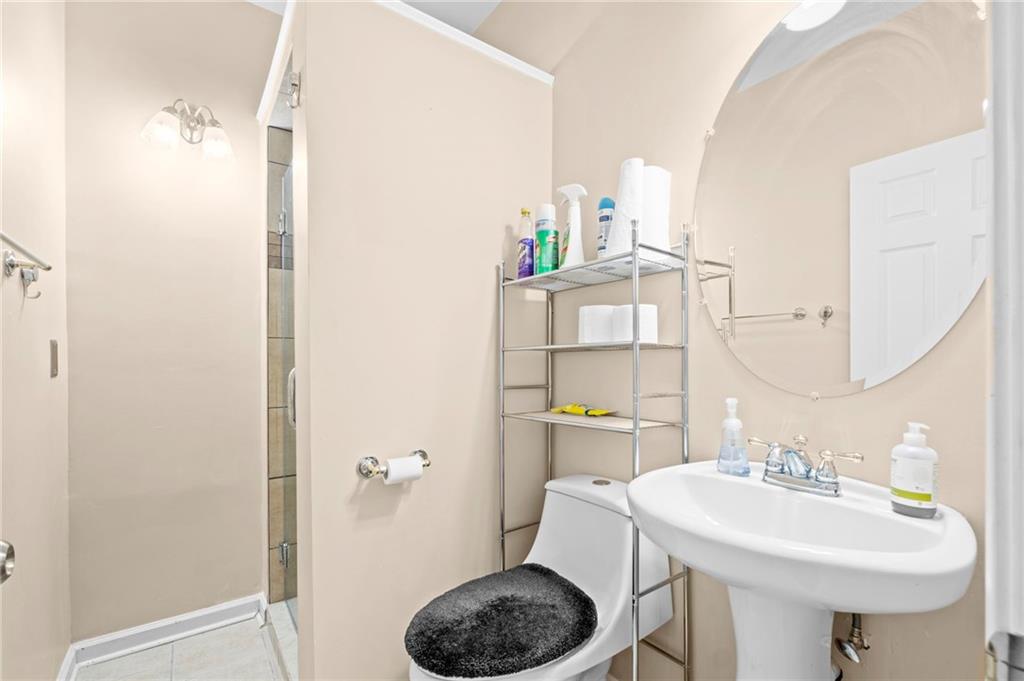 Undisclosed Address Atlanta, GA 30331 - Photo 11 of 25 a bathroom with a sink toilet and a mirror