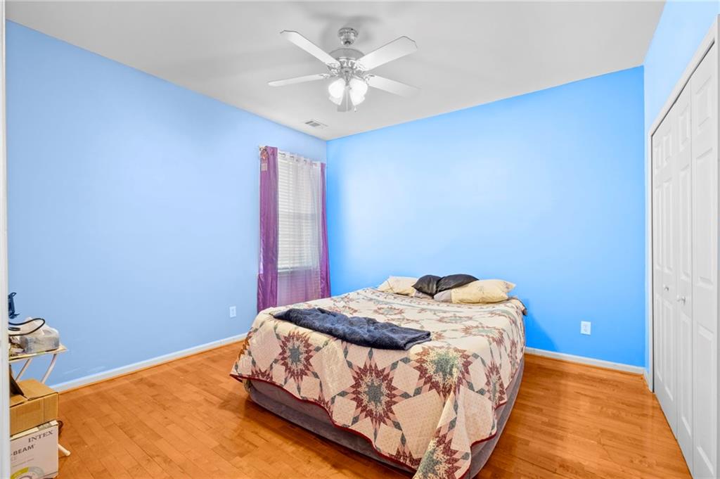 Undisclosed Address Atlanta, GA 30331 - Photo 13 of 25 a bedroom with a bed and a chandelier