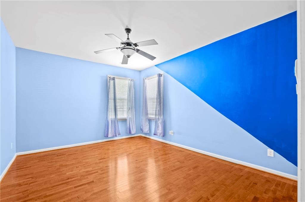 Undisclosed Address Atlanta, GA 30331 - Photo 14 of 25 a view of a big room with carpet and a chandelier fan