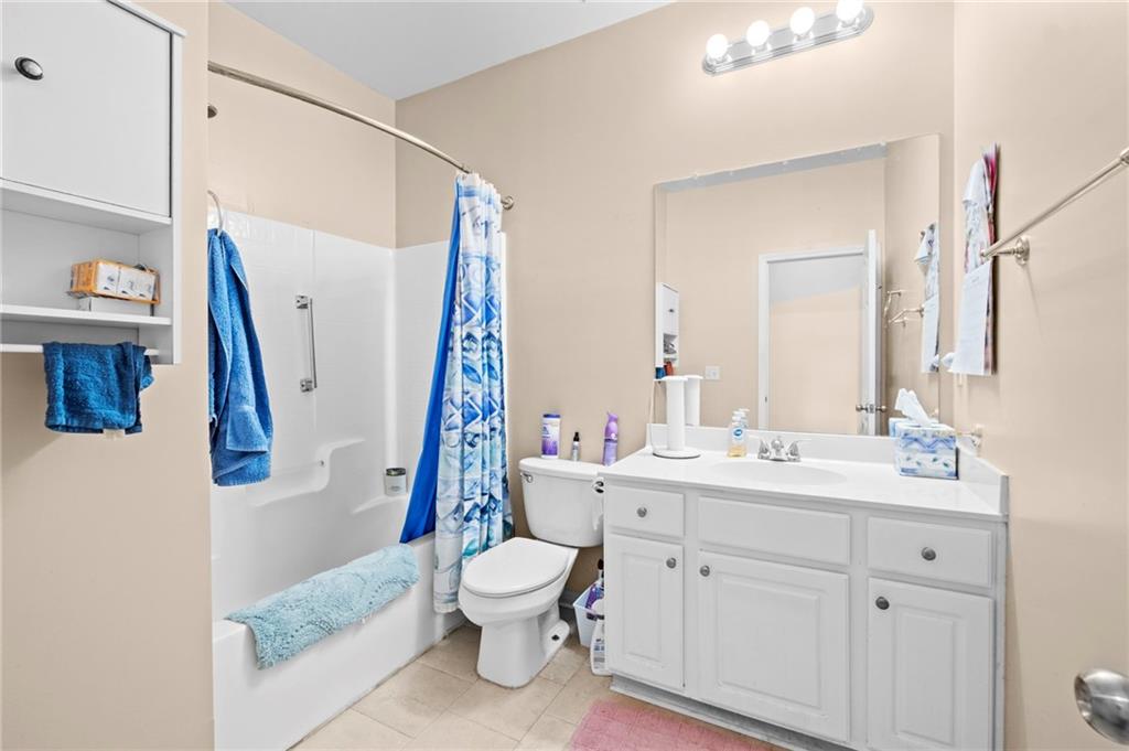 Undisclosed Address Atlanta, GA 30331 - Photo 15 of 25 a bathroom with a toilet sink and mirror