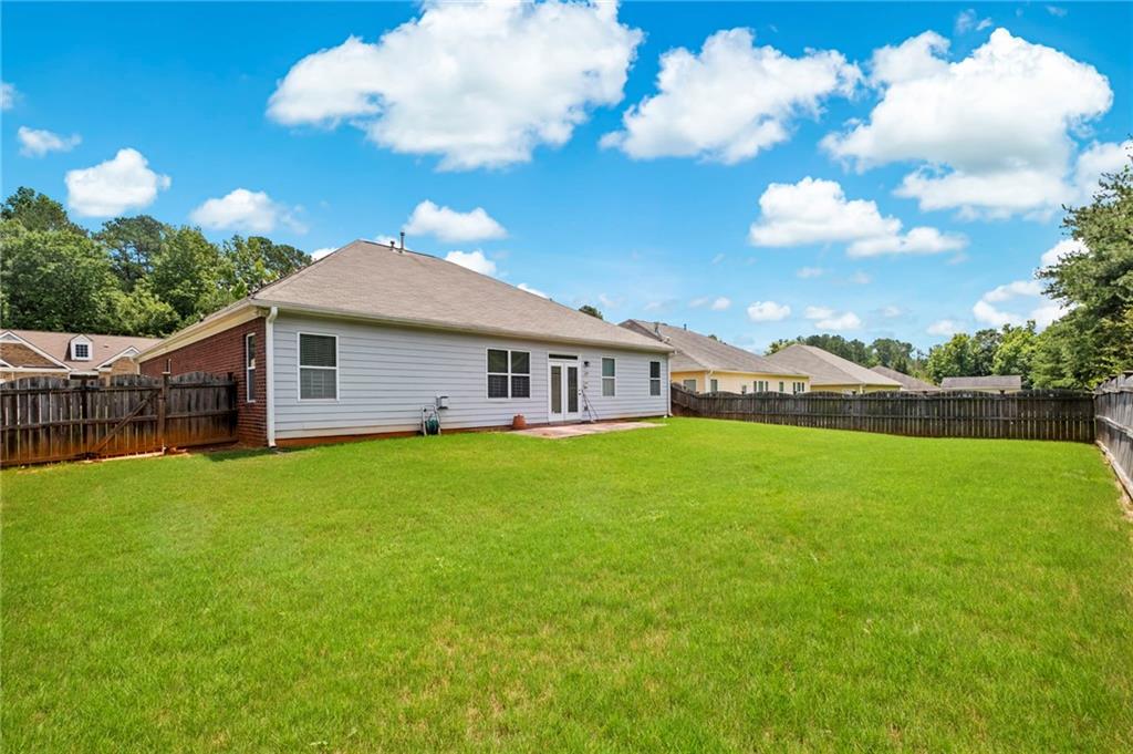 Undisclosed Address Atlanta, GA 30331 - Photo 19 of 25 a front view of a house with garden