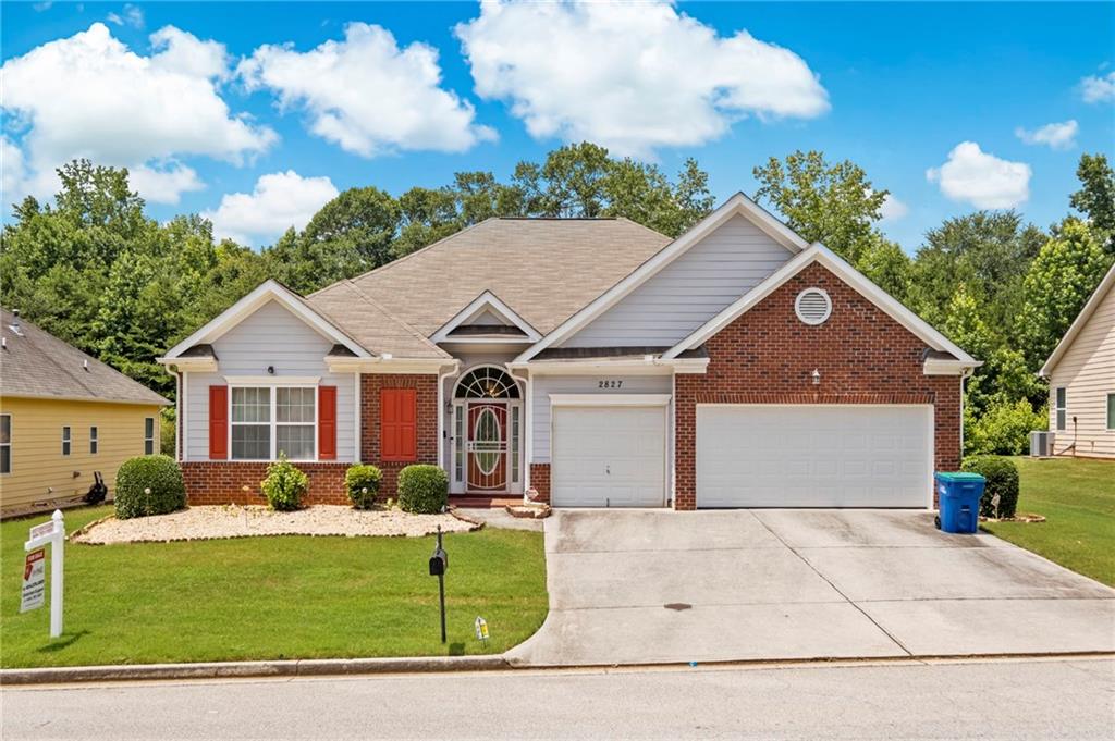 Undisclosed Address Atlanta, GA 30331 - Photo 2 of 25 a front view of a house with garden