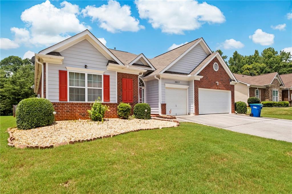 Undisclosed Address Atlanta, GA 30331 - Photo 3 of 25 a front view of a house with a yard