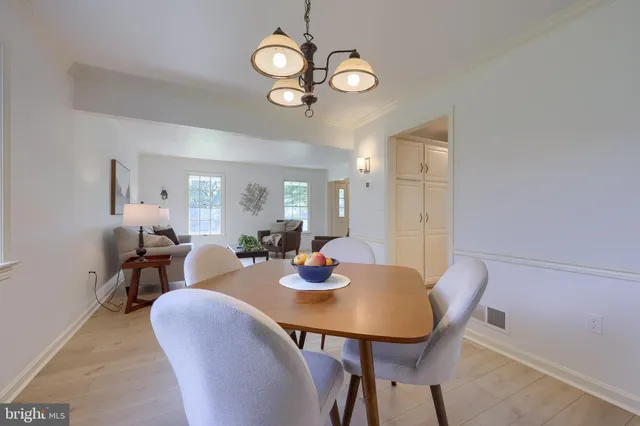 a view of a dining table and chairs in a room