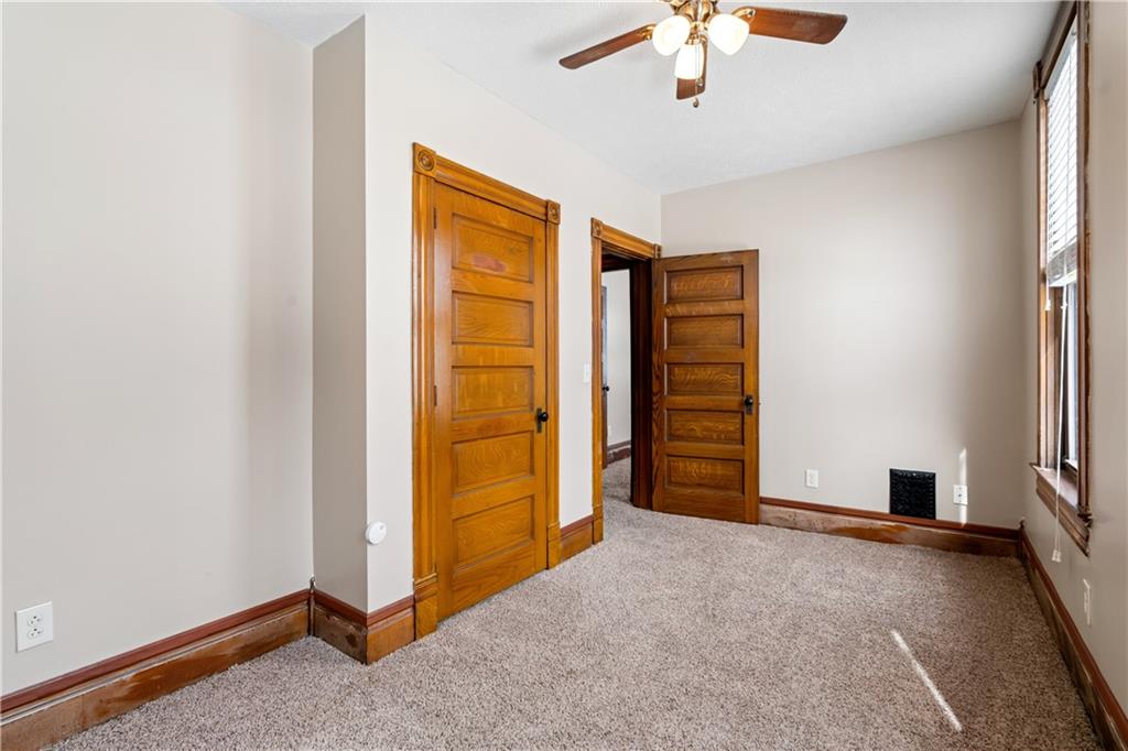 109 North Main Street Houston, PA 15342 - Photo 16 of 25 an empty room with closet and a chandelier fan