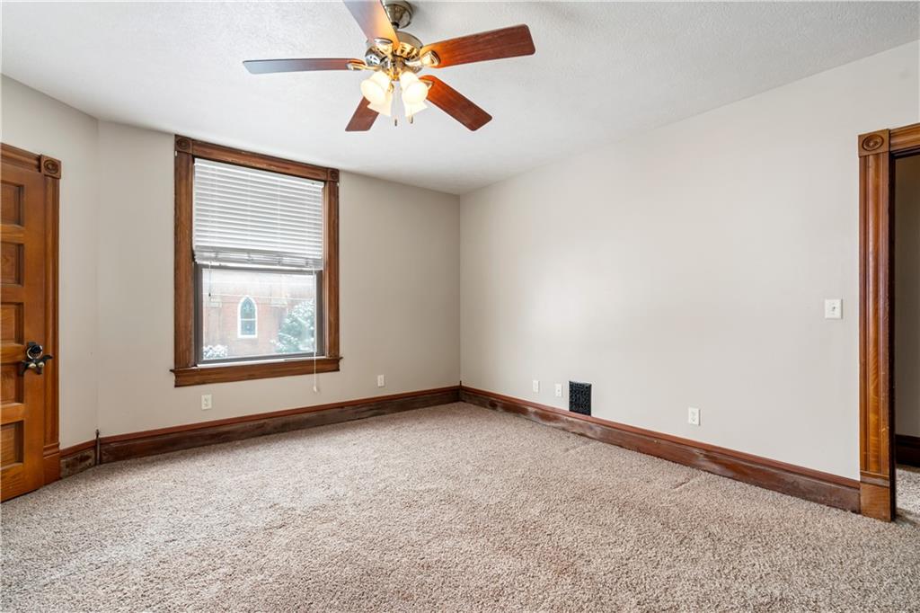109 North Main Street Houston, PA 15342 - Photo 17 of 25 an empty room with windows and fan