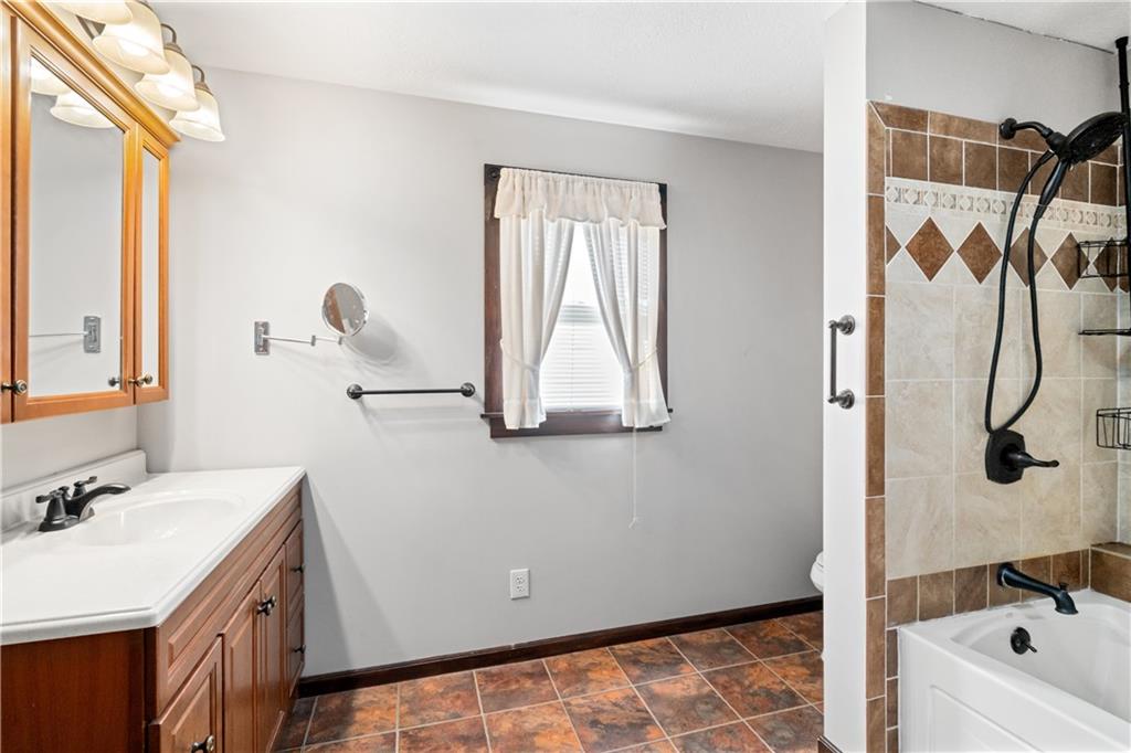 109 North Main Street Houston, PA 15342 - Photo 19 of 25 a bathroom with a bathtub sink and mirror
