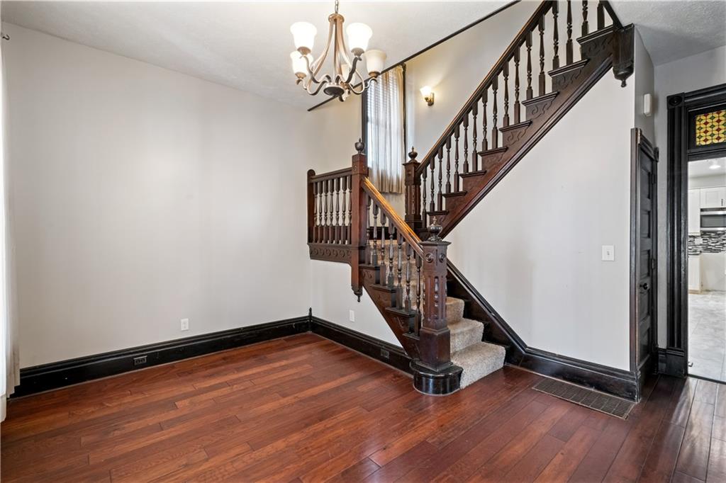 109 North Main Street Houston, PA 15342 - Photo 3 of 25 a view of staircase with wooden floor and fan