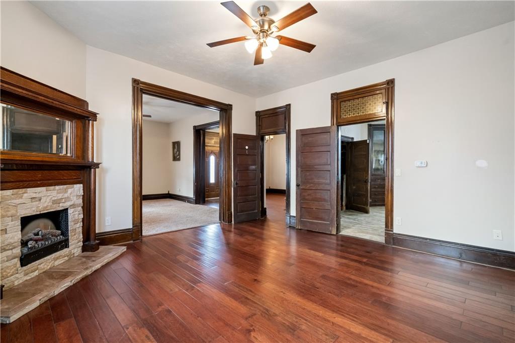 109 North Main Street Houston, PA 15342 - Photo 5 of 25 a view of a livingroom with wooden floor and a fireplace
