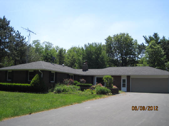 13491 East Bethel Road Rochelle, IL 61068 - Photo 1 of 11 a front view of a house with garden